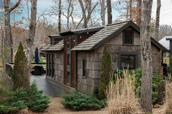 a view of a house with potted plants