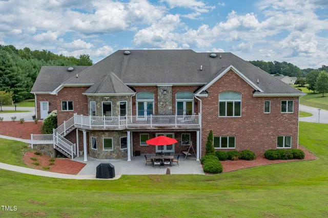 a aerial view of a house with swimming pool and porch