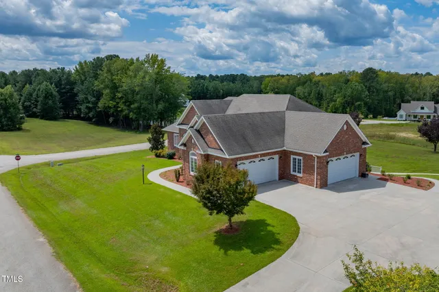 a living room with lots of furniture and a wooden floor