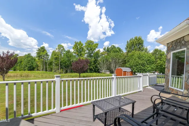 an outdoor space with furniture and umbrella