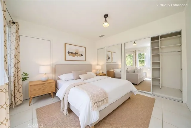 a bedroom with a bed and a cabinets