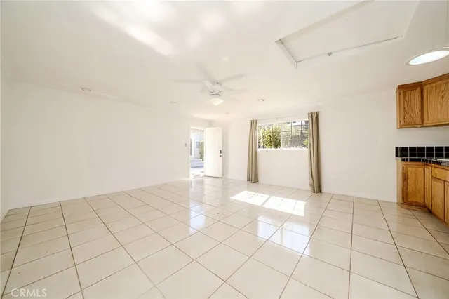 a view of an empty room and a window