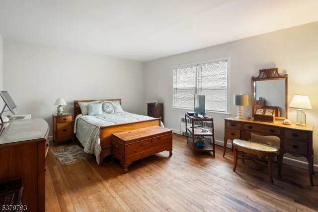 a bedroom with a bed and a table