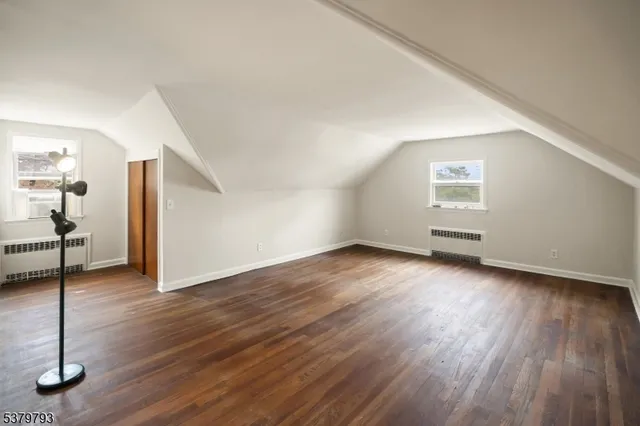 a view of a livingroom with wooden floor