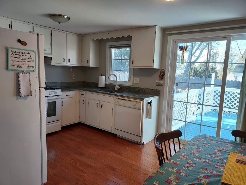 41 Dunstable Cross Road South Dennis, MA 02660 - Photo 11 of 38 a kitchen with stainless steel appliances granite countertop a stove a sink and a refrigerator