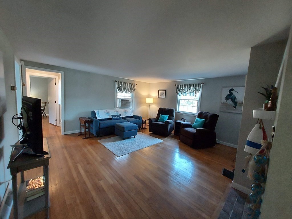 41 Dunstable Cross Road South Dennis, MA 02660 - Photo 14 of 38 a living room with furniture window and a flat screen tv