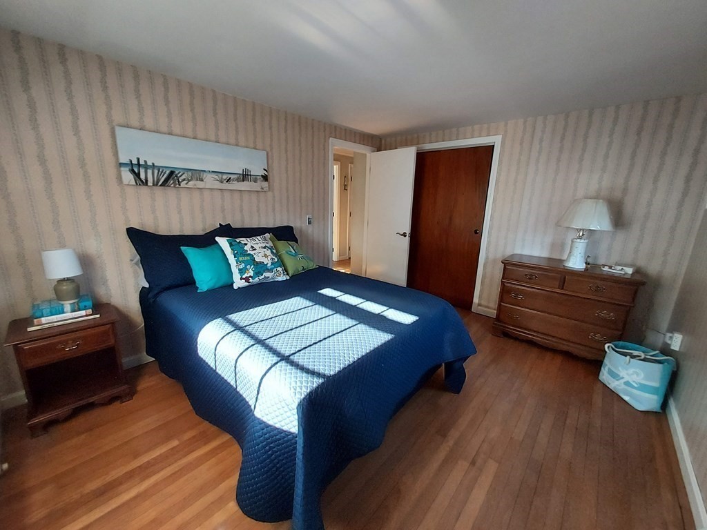 41 Dunstable Cross Road South Dennis, MA 02660 - Photo 29 of 38 a bedroom with a bed and a dresser