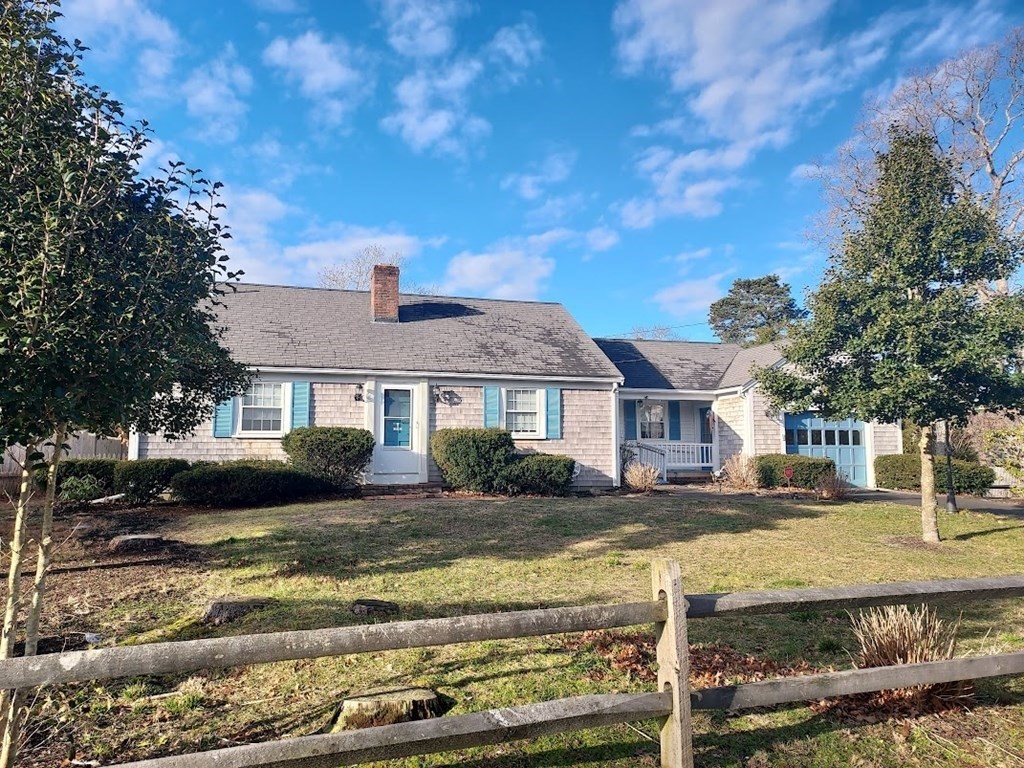 41 Dunstable Cross Road South Dennis, MA 02660 - Photo 3 of 38 a front view of a house with a yard