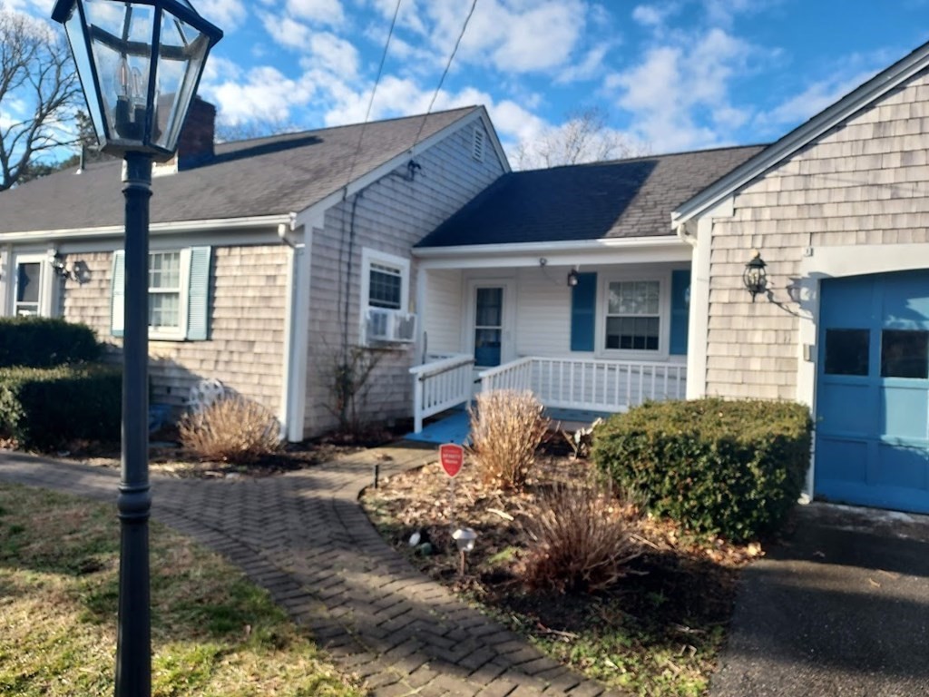 41 Dunstable Cross Road South Dennis, MA 02660 - Photo 5 of 38 a front view of a house with garden