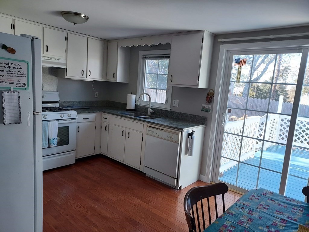 41 Dunstable Cross Road South Dennis, MA 02660 - Photo 6 of 38 a kitchen with stainless steel appliances granite countertop a stove a sink and a refrigerator