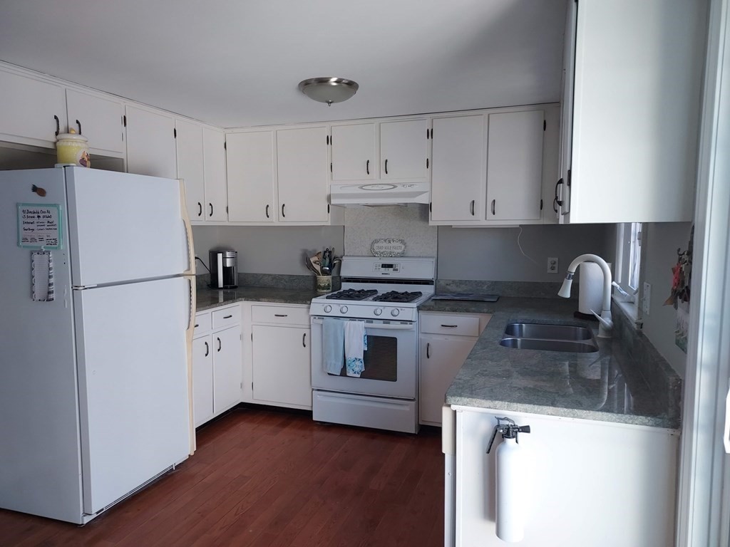 41 Dunstable Cross Road South Dennis, MA 02660 - Photo 9 of 38 a kitchen with cabinets appliances a sink and a counter space
