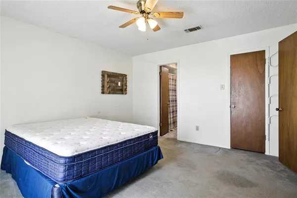 a room with a bed and a chandelier