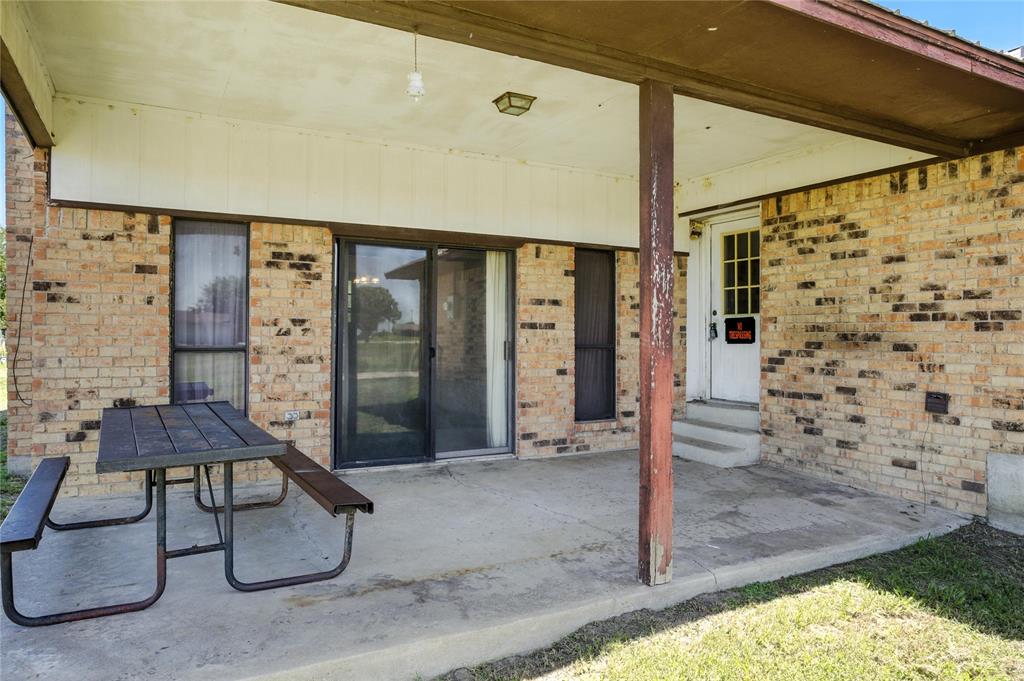 105 Greenhill Lane Cooper, TX 75432 - Photo 17 of 31 a balcony view with a couple of couches and potted plants