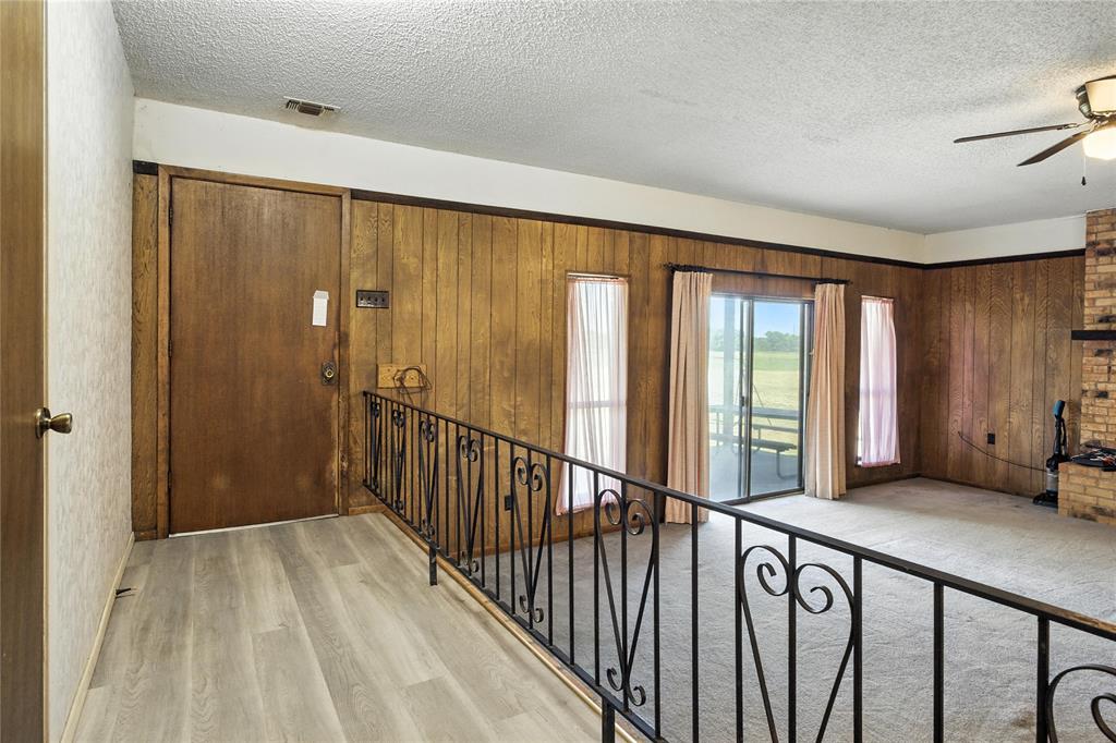 105 Greenhill Lane Cooper, TX 75432 - Photo 2 of 31 a view of an entryway with wooden floor