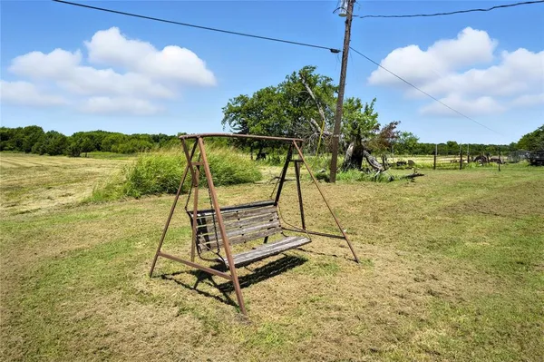 a house with trees in the background