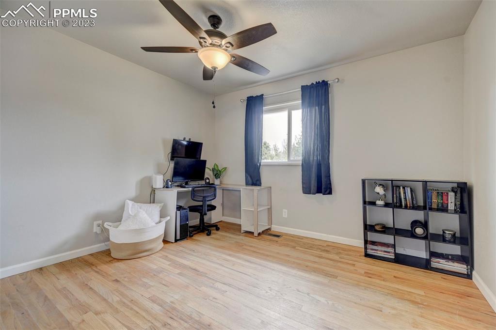 113 Kiva Road Colorado Springs, CO 80911 - Photo 11 of 12 a bedroom with furniture and window