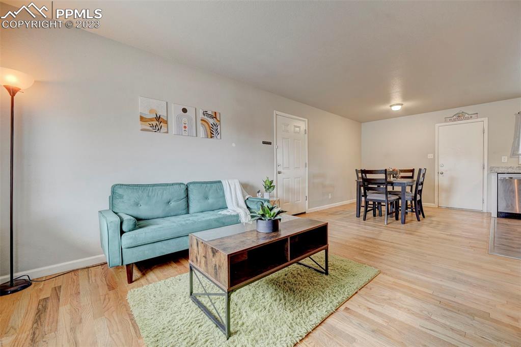 113 Kiva Road Colorado Springs, CO 80911 - Photo 3 of 12 a living room with furniture and wooden floor