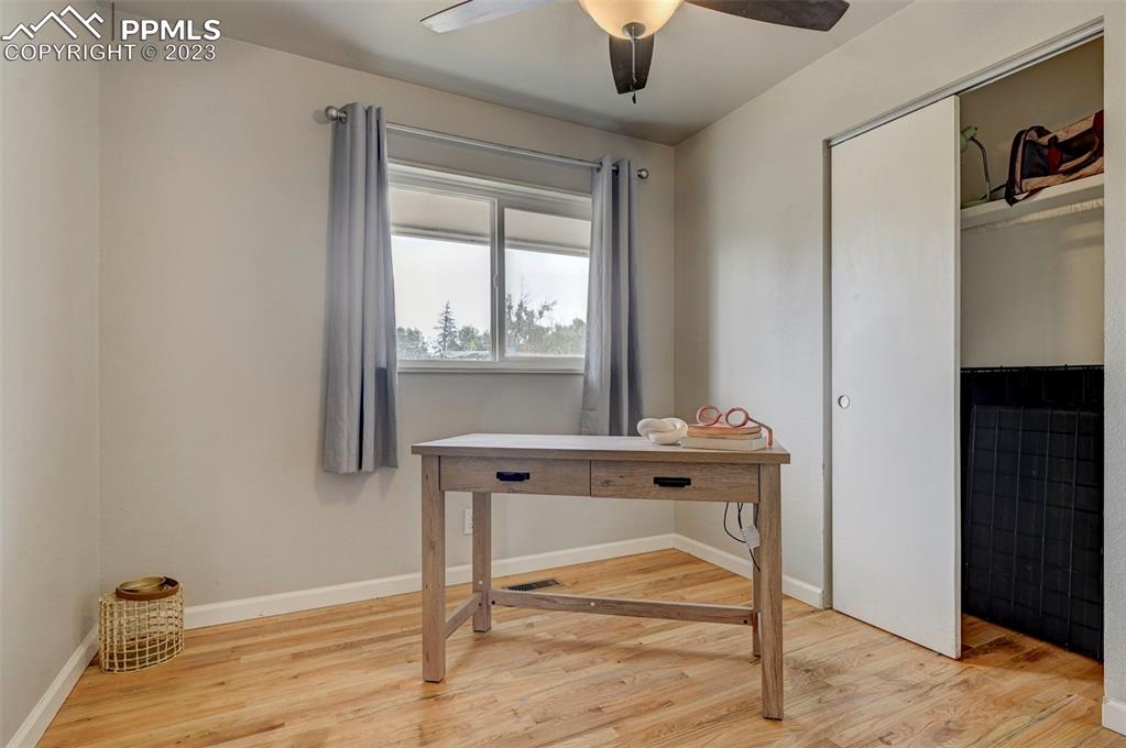113 Kiva Road Colorado Springs, CO 80911 - Photo 9 of 12 a view of an entryway with table and mirror