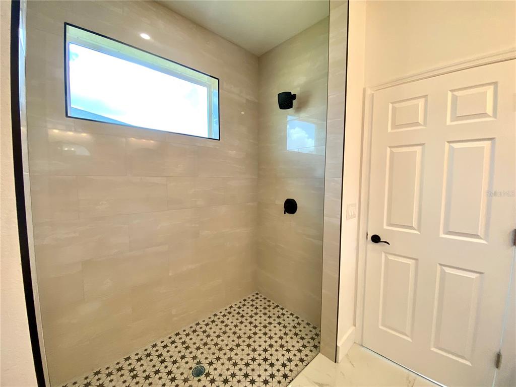 4501 Schumacher Road Sebring, FL 33872 - Photo 20 of 31 a bathroom with a shower