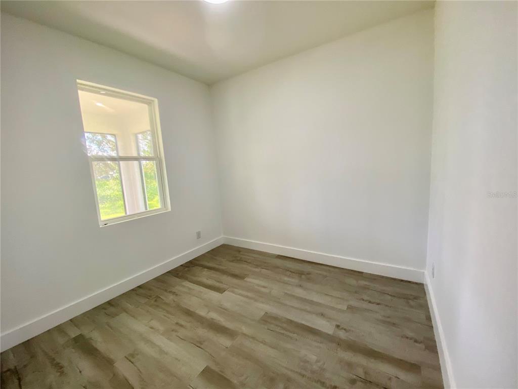 4501 Schumacher Road Sebring, FL 33872 - Photo 28 of 31 an empty room with a window