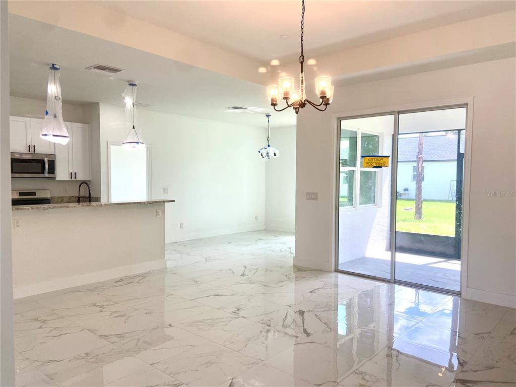 4501 Schumacher Road Sebring, FL 33872 - Photo 3 of 31 a view of a kitchen with a stove and kitchen view