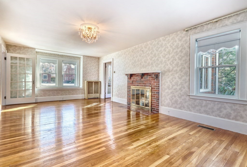 257 Lawrence Road Medford, MA 02155 - Photo 11 of 29 a view of empty room with wooden floor and fan