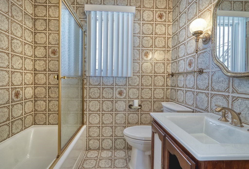 257 Lawrence Road Medford, MA 02155 - Photo 17 of 29 a bathroom with a sink a toilet and shower