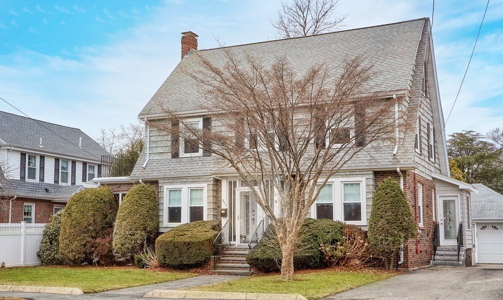 257 Lawrence Road Medford, MA 02155 - Photo 2 of 29 a front view of a house with garden