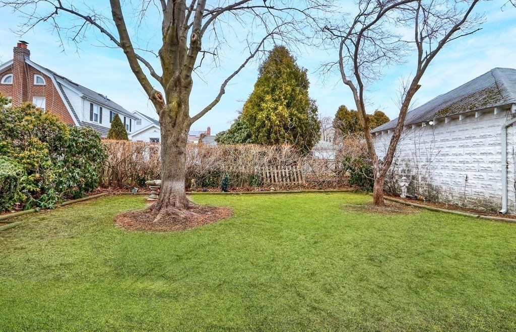 257 Lawrence Road Medford, MA 02155 - Photo 29 of 29 a backyard of a house with lots of green space