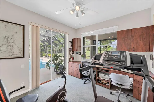 a workspace with furniture and a chandelier