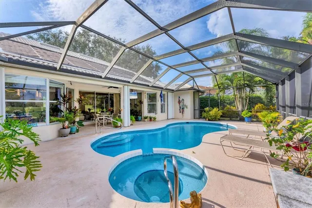 a view of a patio with table and chairs and potted plants