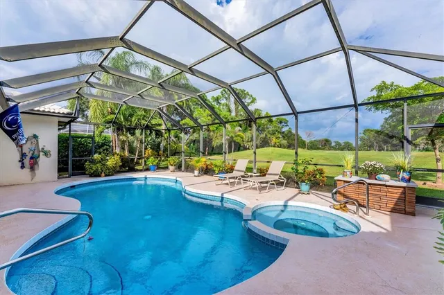a view of swimming pool with outdoor seating