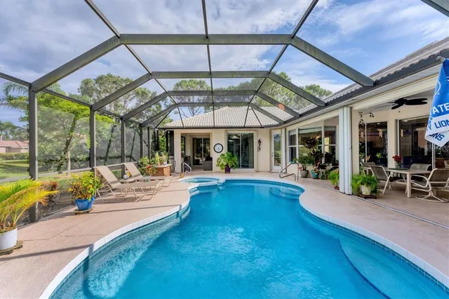 a view of a swimming pool with a patio