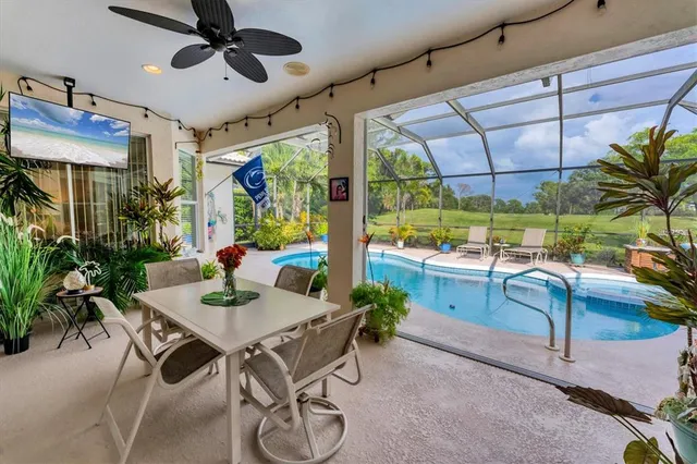 a view of a dining room with furniture window and outside view