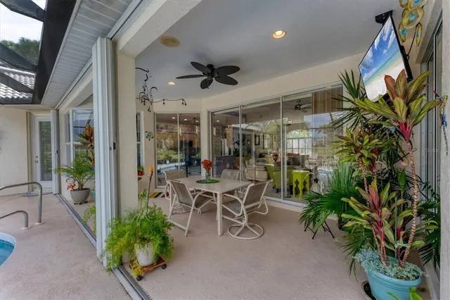 a view of a swimming pool with a patio