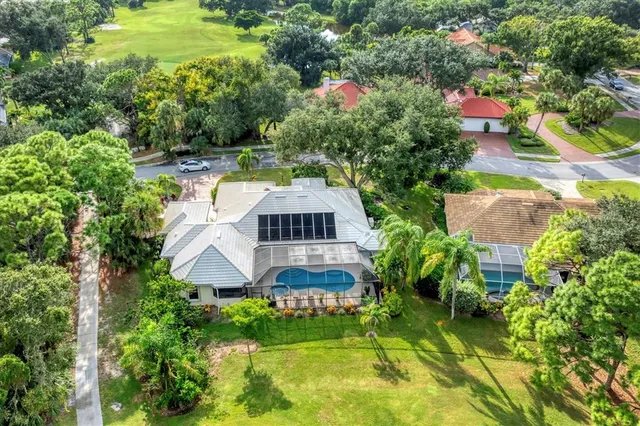 an aerial view of residential house with a yard