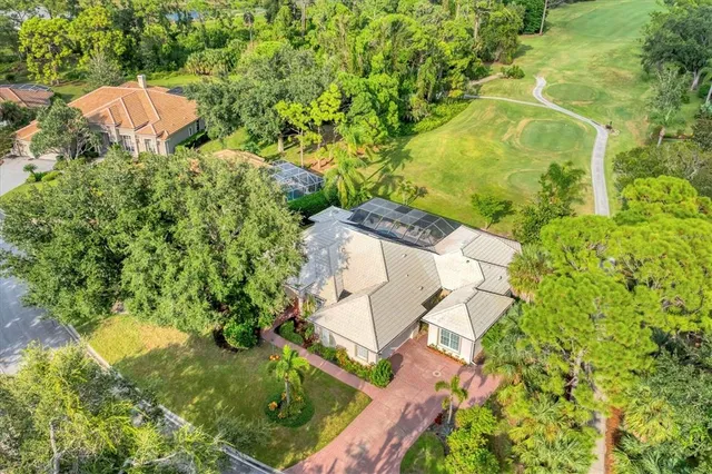 an aerial view of a houses with a lake view