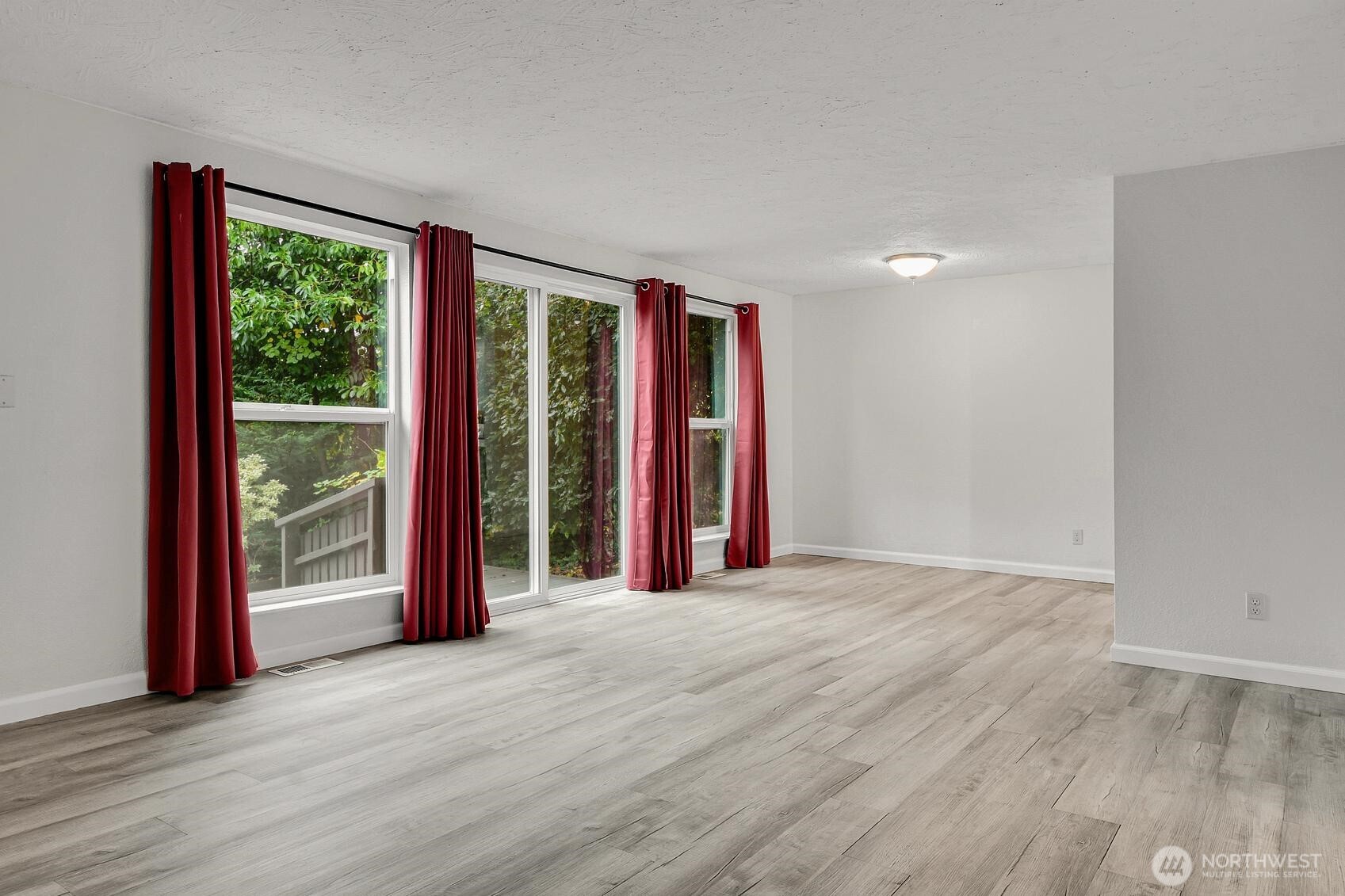 184 Southwest 200th Street Normandy Park, WA 98166 - Photo 3 of 20 a view of a room with wooden floor and a window