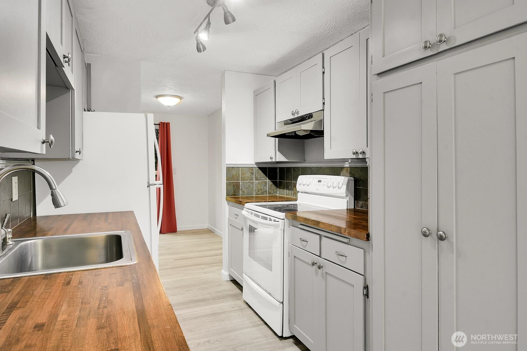 184 Southwest 200th Street Normandy Park, WA 98166 - Photo 9 of 20 a kitchen with white cabinets and appliances