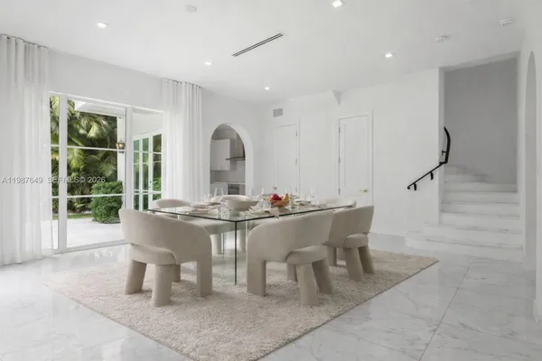 a view of a dining room with furniture window and outside view