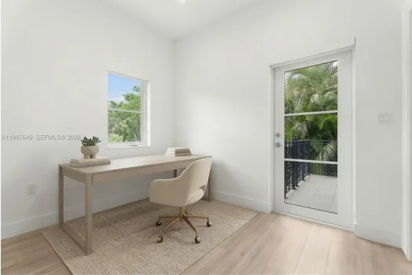 a workspace with furniture and a window