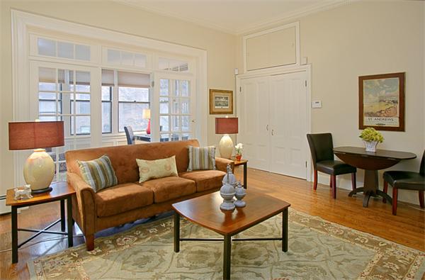 315 Beacon Street, Unit 5 Boston, MA 02116 - Photo 1 of 10 a living room with furniture wooden floor and a table
