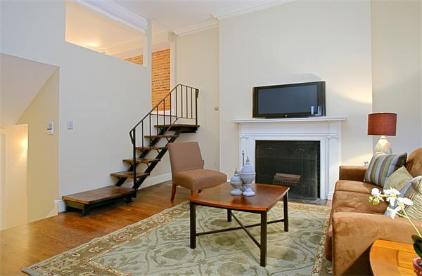 315 Beacon Street, Unit 5 Boston, MA 02116 - Photo 3 of 10 a living room with furniture and a fireplace