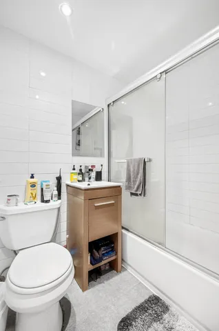 a view of a patio with table and chairs a barbeque
