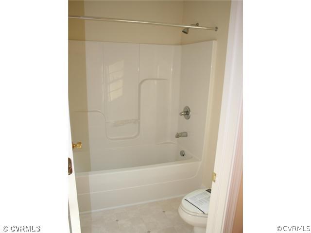 4 Winding Ridge Way Bumpass, VA 23024 - Photo 8 of 12 a bathroom with a bathtub and shower