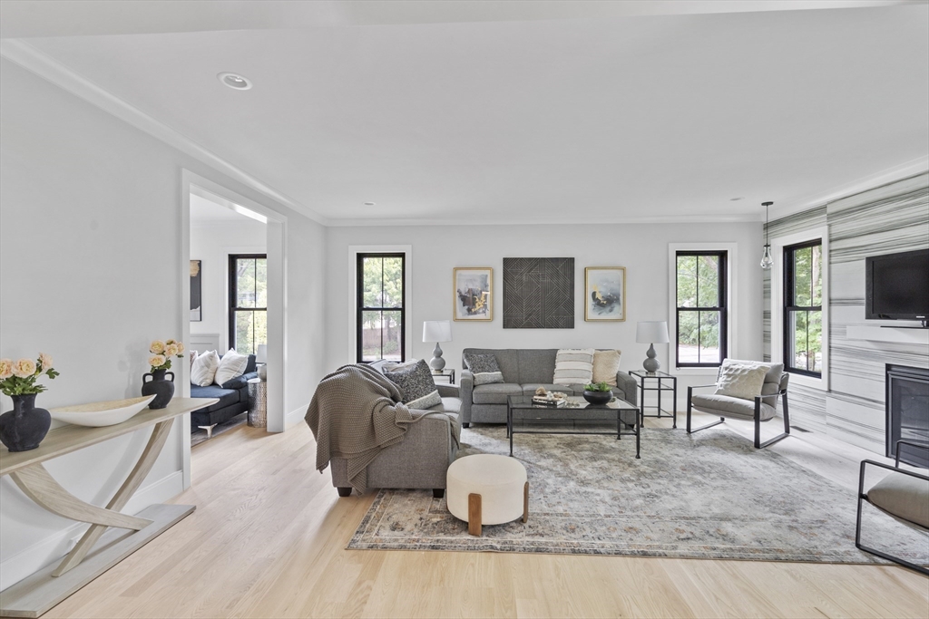 11 Avon Lane Natick, MA 01760 - Photo 6 of 21 a living room with furniture and a flat screen tv