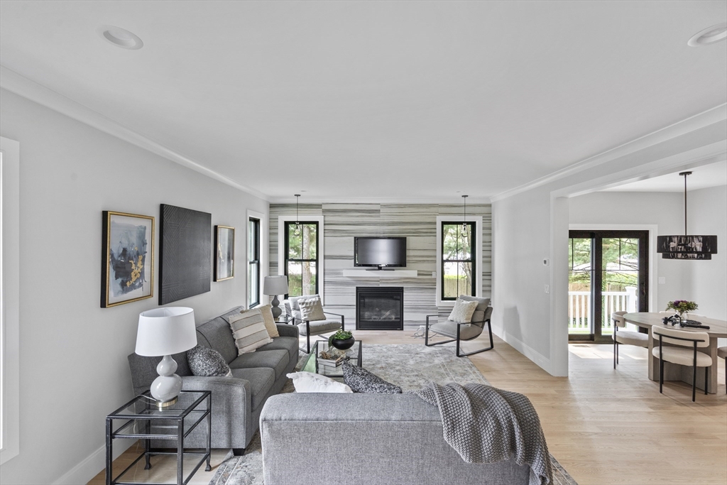 11 Avon Lane Natick, MA 01760 - Photo 8 of 21 a living room with furniture and a fireplace