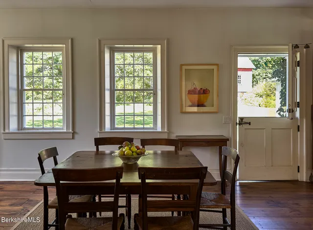 a dining room with furniture and window
