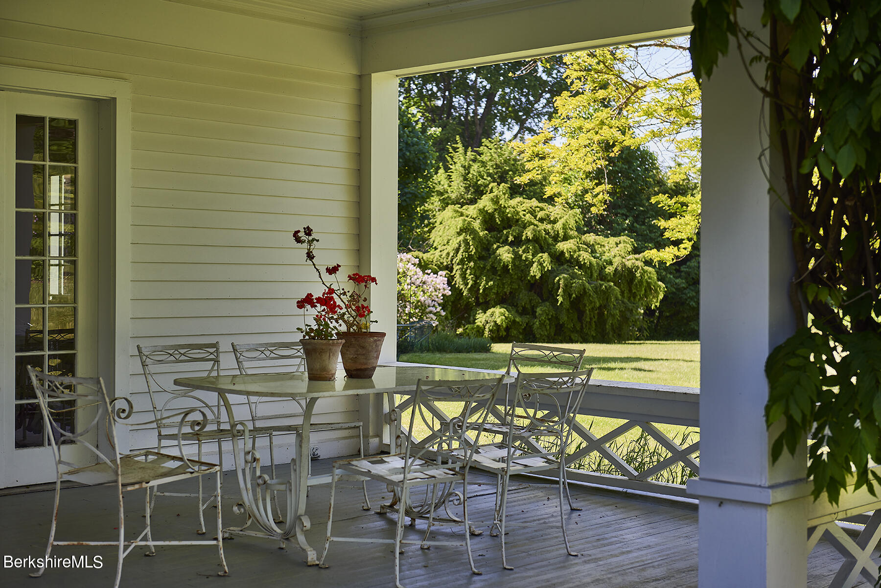 17 East Street Stockbridge, MA 01262 - Photo 15 of 43 Copy of Porch - table and geraniums