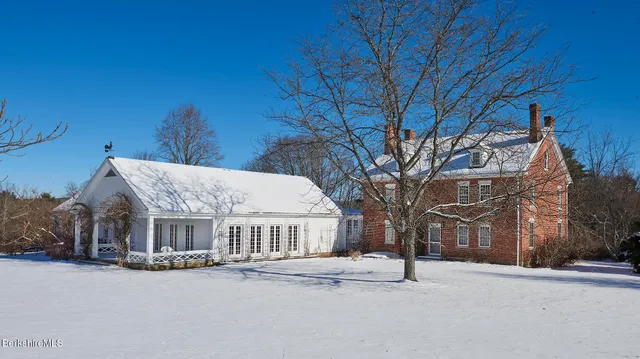 a view of a building with a yard